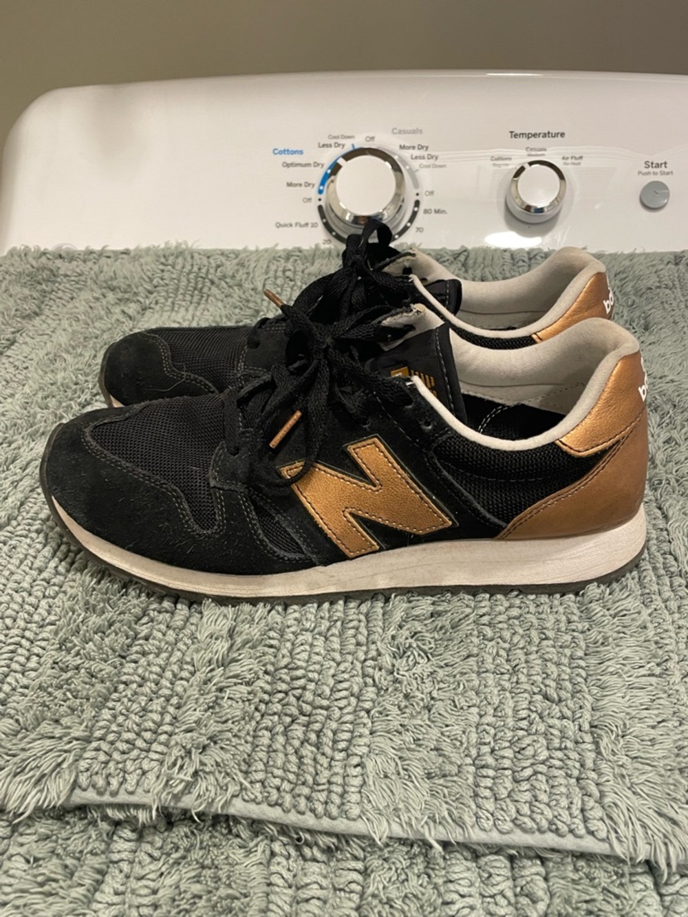 New Balance women’s Black and Bronze Low-Top Sneakers, 10